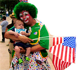 Photo - Greenie holds a baby and American flags